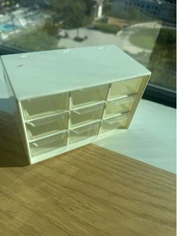 Storage box for jewelry, nail supplies, and other accessories.