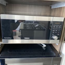 Galanz 1.6 Cu Ft ExpressWave Sensor Cooking Microwave Oven with an easy-to-use Express Cooking. 5EGBN