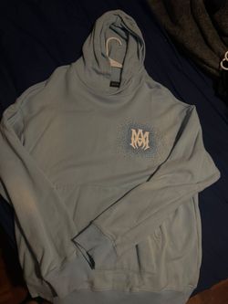 Blue Amiri hoodie with gem logo