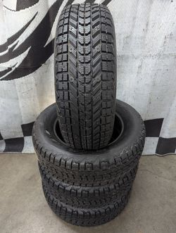 215/65r16 "Nubby New" Firestone Winter-Force studded winter snow tires
