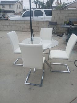 Glass table with 4 chairs