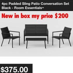 New in box 4-Piece Padded Sling Patio Conversation Set from Room Essentials™. This patio conversation set includes one coffee table, two armchairs and
