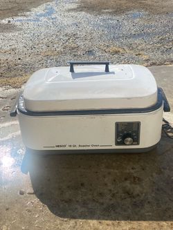 This appliance is a Nesco 18 Quart Roaster Oven designed for roasting, baking, cooking, and steaming.