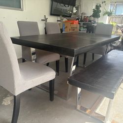 Wooden Table with 4 Chairs and Branch