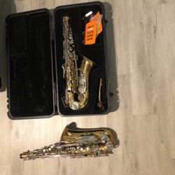 Two Used Saxophones (Both Of Them Come With a Case)