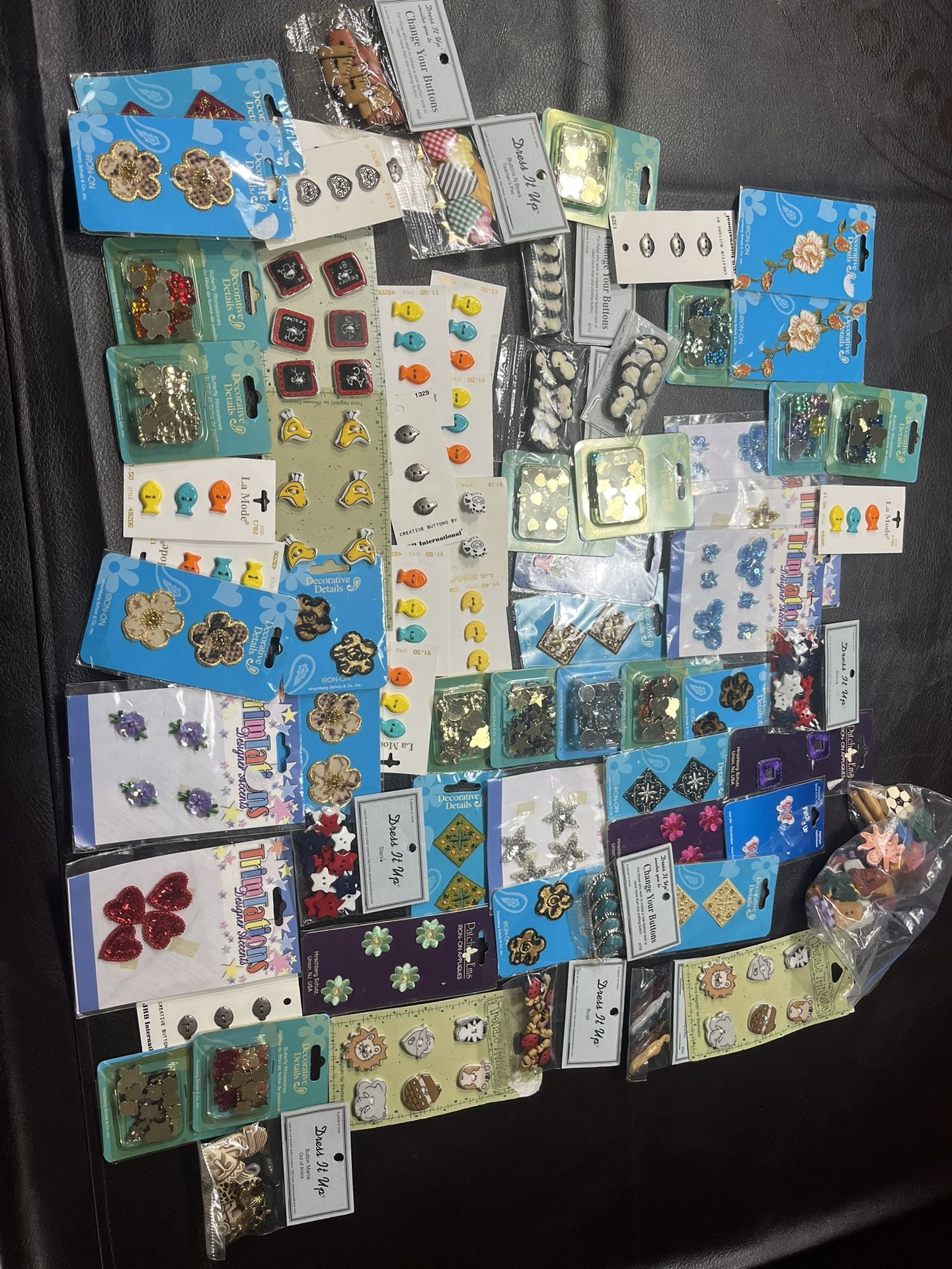Buttons, Rhinestones, iron on patches. All included see pictures, please.
