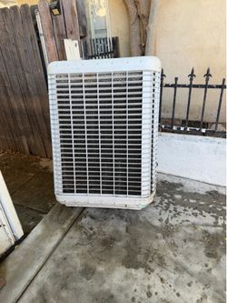Window evaporative cooler
