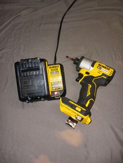 DEWALT 20V MAX Brushless Cordless Impact Driver & Lithium-Ion Battery and a MAX Charger.