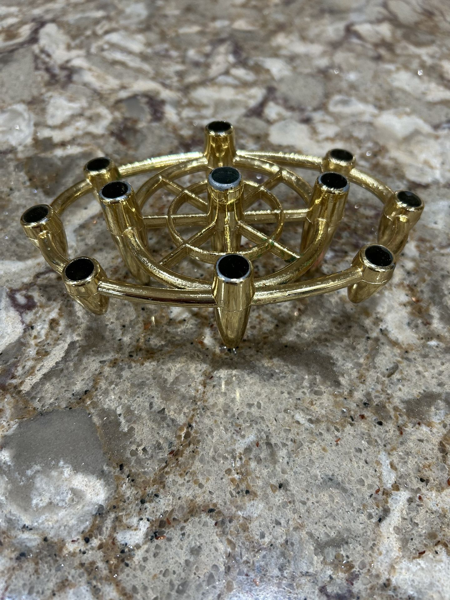 Elegant gold candle holder with nine slots