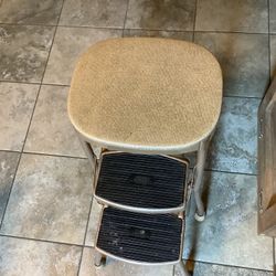 Vintage Cosco metal multi step stool folds in for storage approximately 26” tall padded top with non-slip steps  Plainfield, Illinois