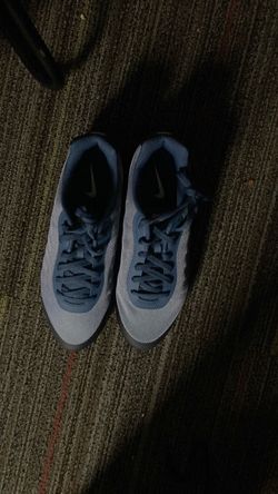 blue and white Nike Air Max Invigor