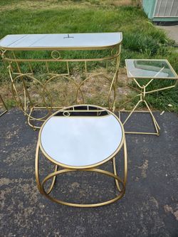 3 gold tables with glass tops