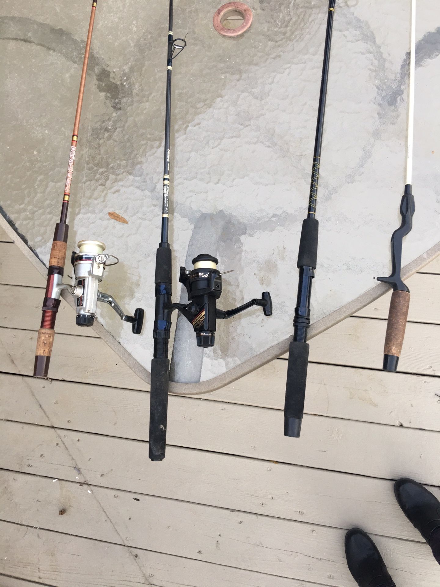 4 FISHING RODS SOLD AS A PACKAGE