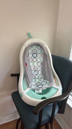 Green and white Fisher price different stages baby bath tub with infant support mesh
