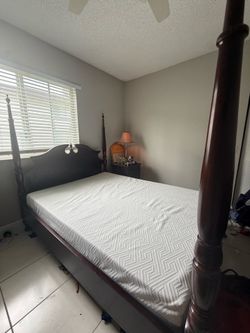 Victorian wood bed frame with queen mattress