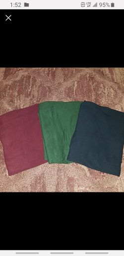 3 comfertable strechy material pencil skirts. From England: sizes are in UK Green and Burgundy is a UK12 Navy is a UK14.