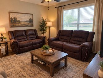 Two brown leather recliners