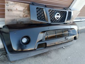 2007-2013 Nissan Armada front bumper with All the accessories oem.