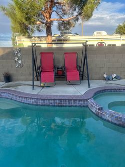 Red and black swinging chairs