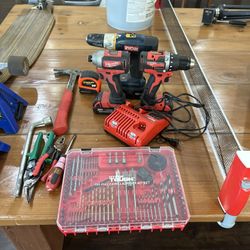 A Set Of Drills And Drillbits And Charger