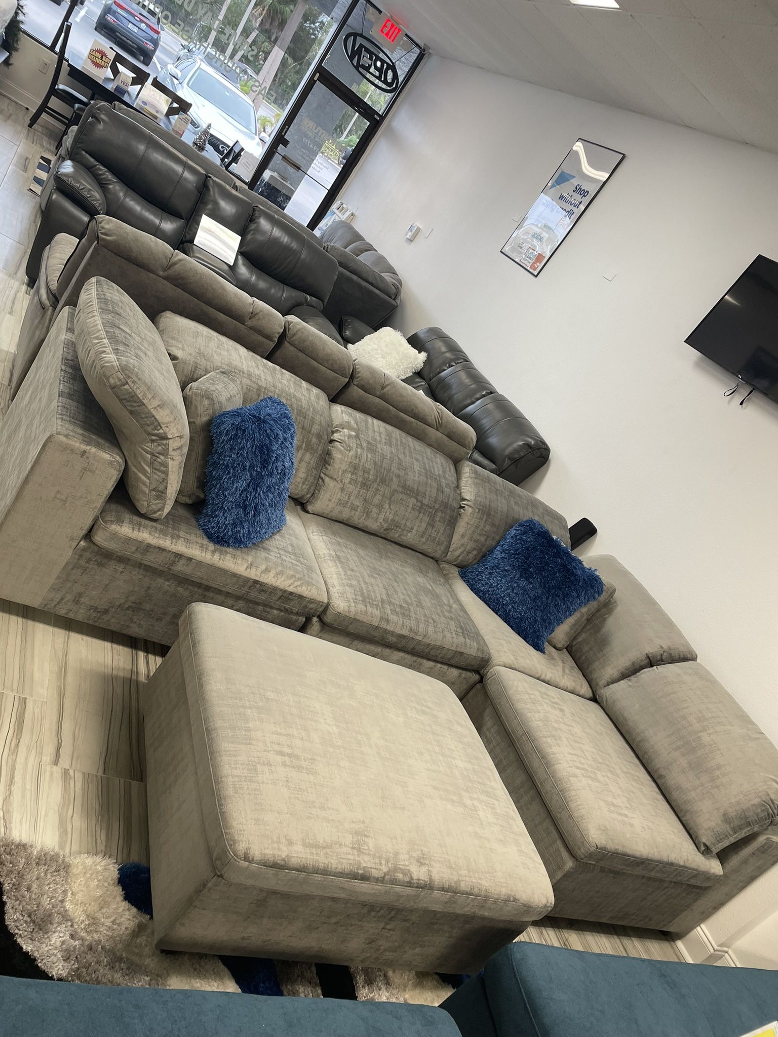 Going out of business sale. Lima gray sectional with ottoman now $899. Easy finance option. Same day delivery.