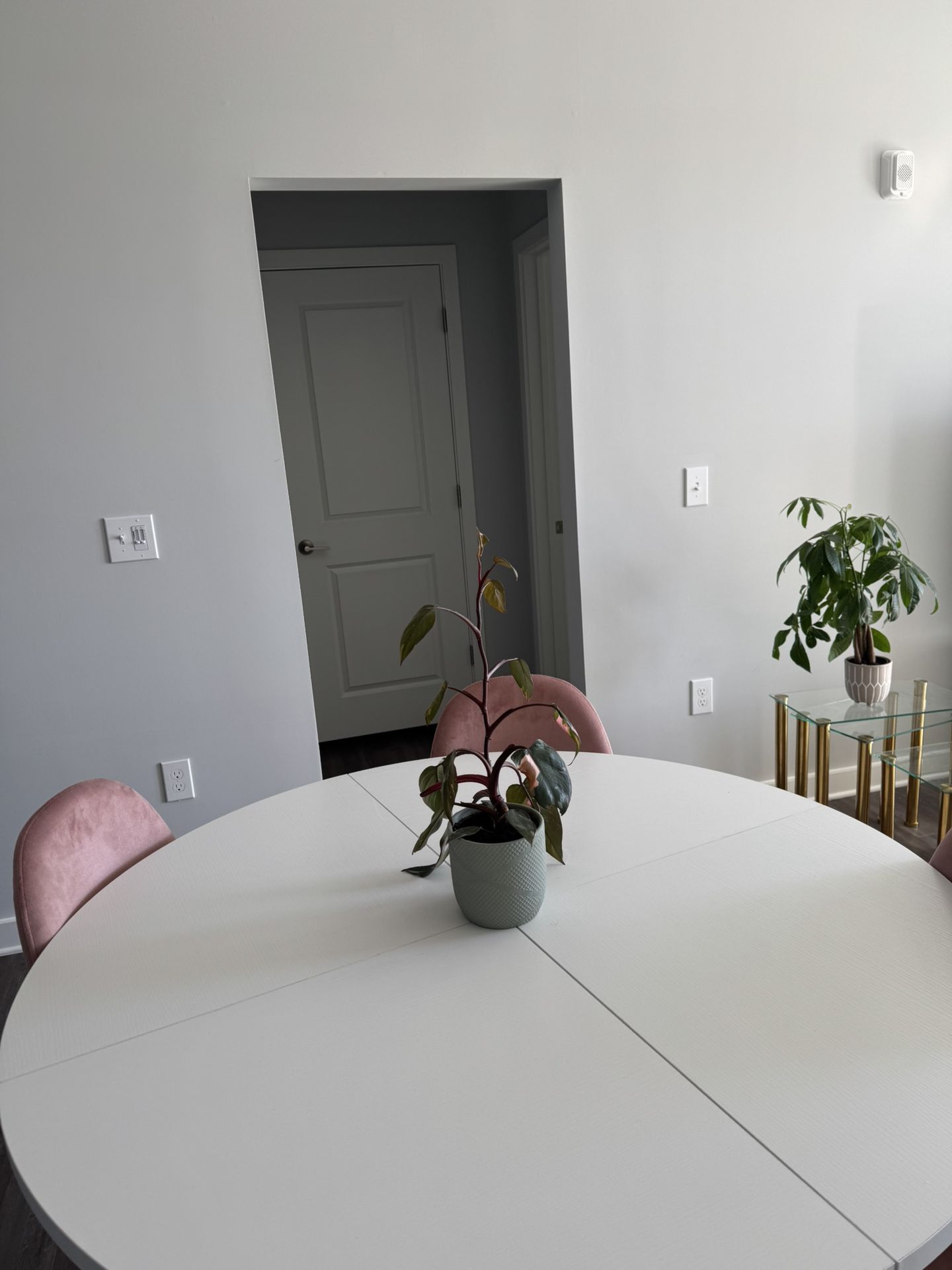 White Dining Table With 4 Pink Chairs