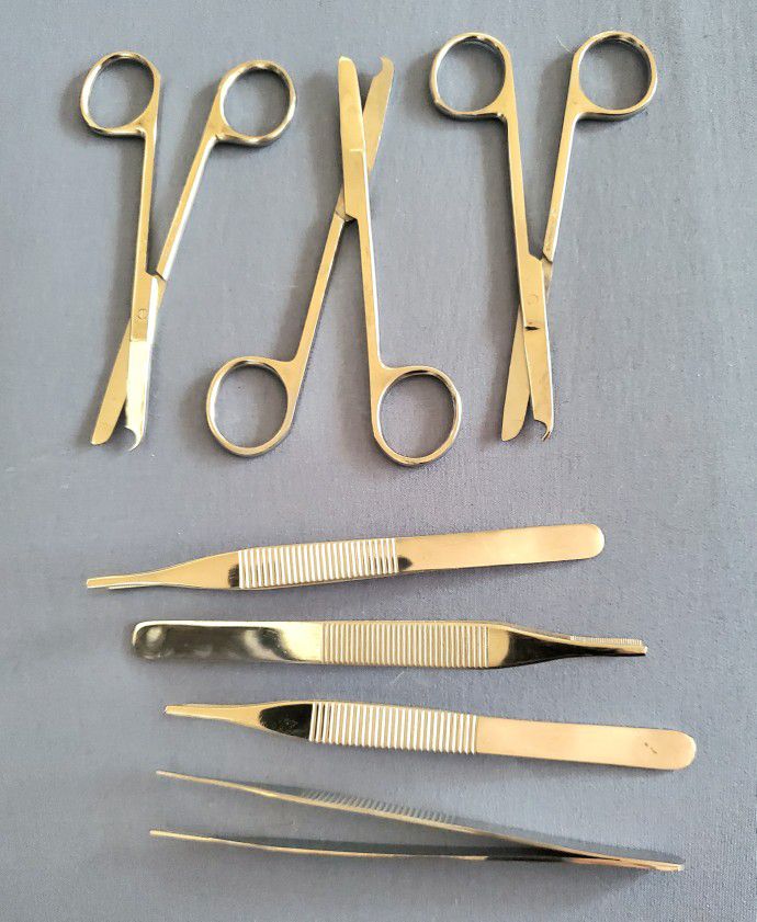 A Set of 7 Pc. Stainless Steel Suture Scissors and Dressing Tweezers