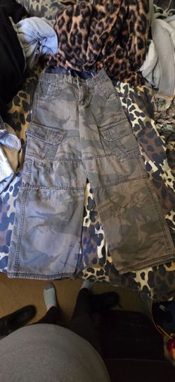 Boys cargo camo jeans with Adjusters and pockets in the front Velcro pockets and pockets in the back