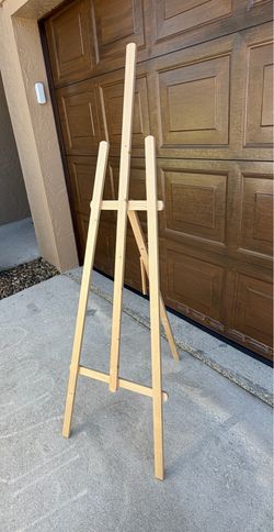 adjustable, natural wood easel is suitable for painting, sketching, or displaying art and signs