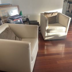 Off White Leather Swivel Armchairs