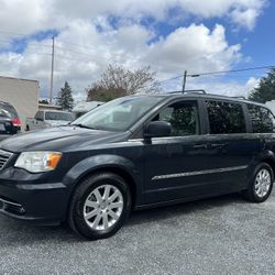 2014 Chrysler Town & Country Touring Minivan Clean title  218k miles Runs great  Stow and go seating  Power side and rear doors  Good cheap family van