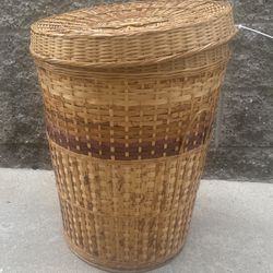 woven bamboo or wicker hamper/basket. 