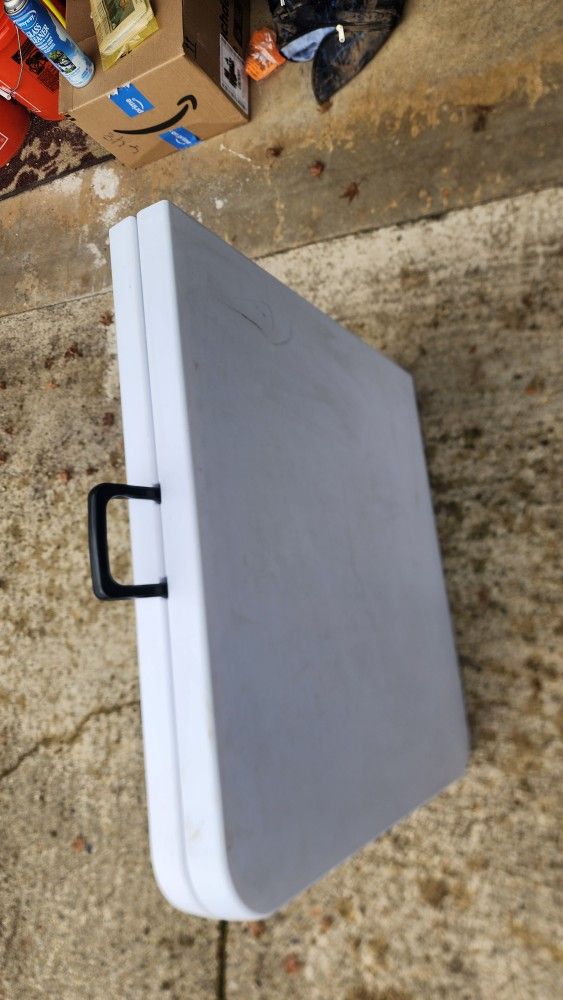 9 Black Folding Chairs And Table.