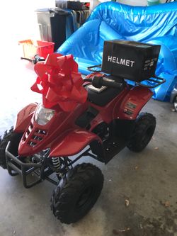 Red Youth 4 wheel ATV w/title