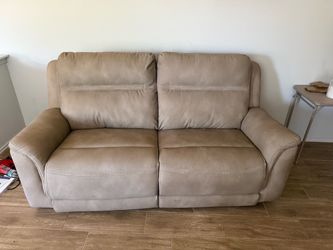 Delivery available Beige Leather Reclining Loveseat