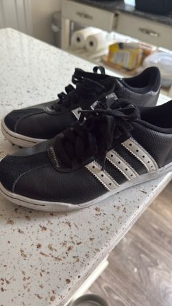 Black leather adidas golf cleat shoe