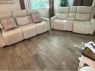 Off white sofa and loveseat with 4 power and reclining chairs with USB chargers