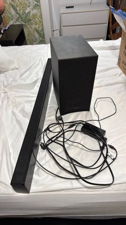 Black Soundbar with Subwoofer and Cables
