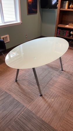 Frosted glass oval table with adjustable height legs