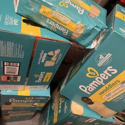 Size 1 Pamper Diapers And One Newborn Pack 
