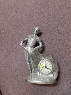Silver metal Matador clock