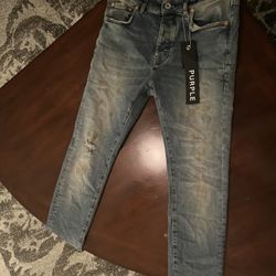 Jeans with purple tag online