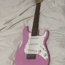 Squier pink electric guitar