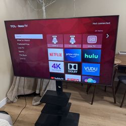 TV 65 inches TLC Roku Tv  4K , and TV stand 