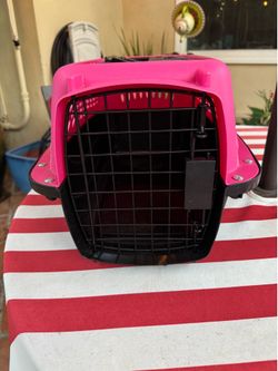 Small pink pet carrier