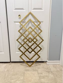 Beautiful golden 40 by 20 inch metal wall decor. (MUST SELL TODAY)