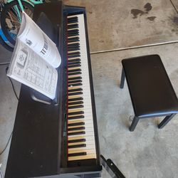 Black gently used piano for sale