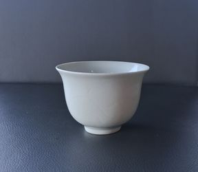 Chinese porcelain cup with carved patterns