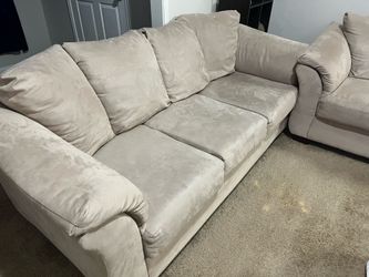 Beige couch and loveseat set