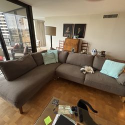Cozy Grey L-shaped Couch With Wooden Base